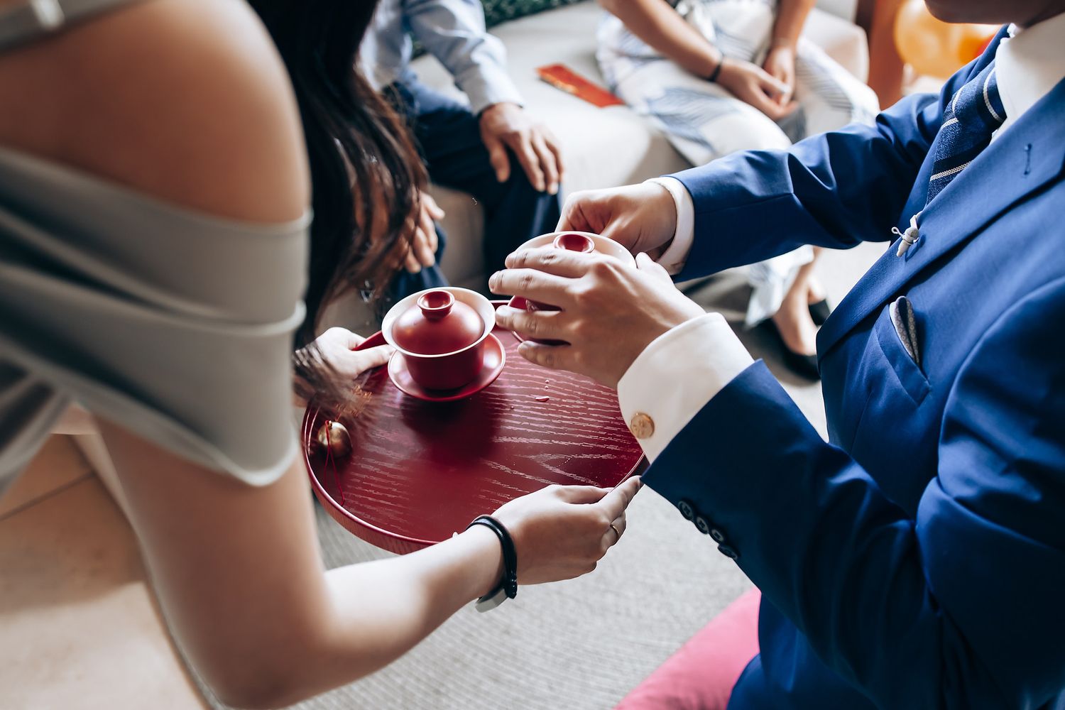 Guests enjoying drinks and conversation at an elegant wedding reception.