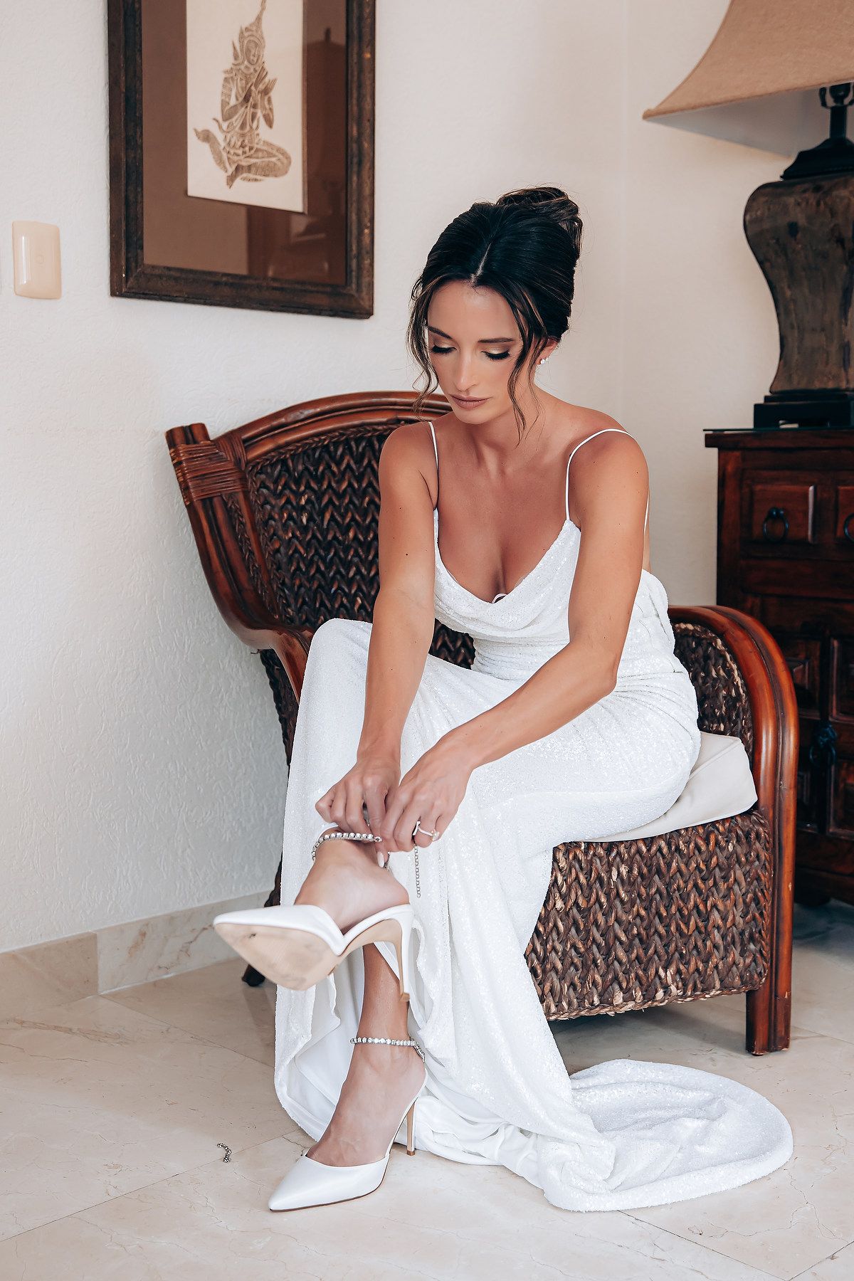 A person in a white dress sits on a wooden chair putting on shoes in a series of getting ready photos.