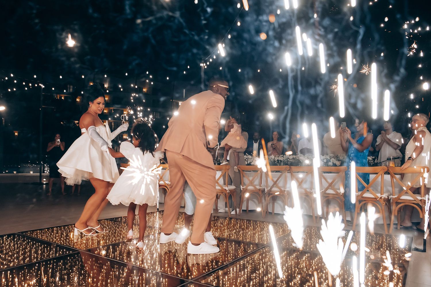 Sparklers create magical light trails during an evening celebration.