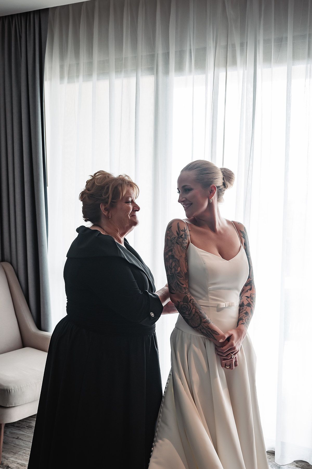 A series of emotional moments showing someone getting ready in a white dress while being embraced by a person in black.