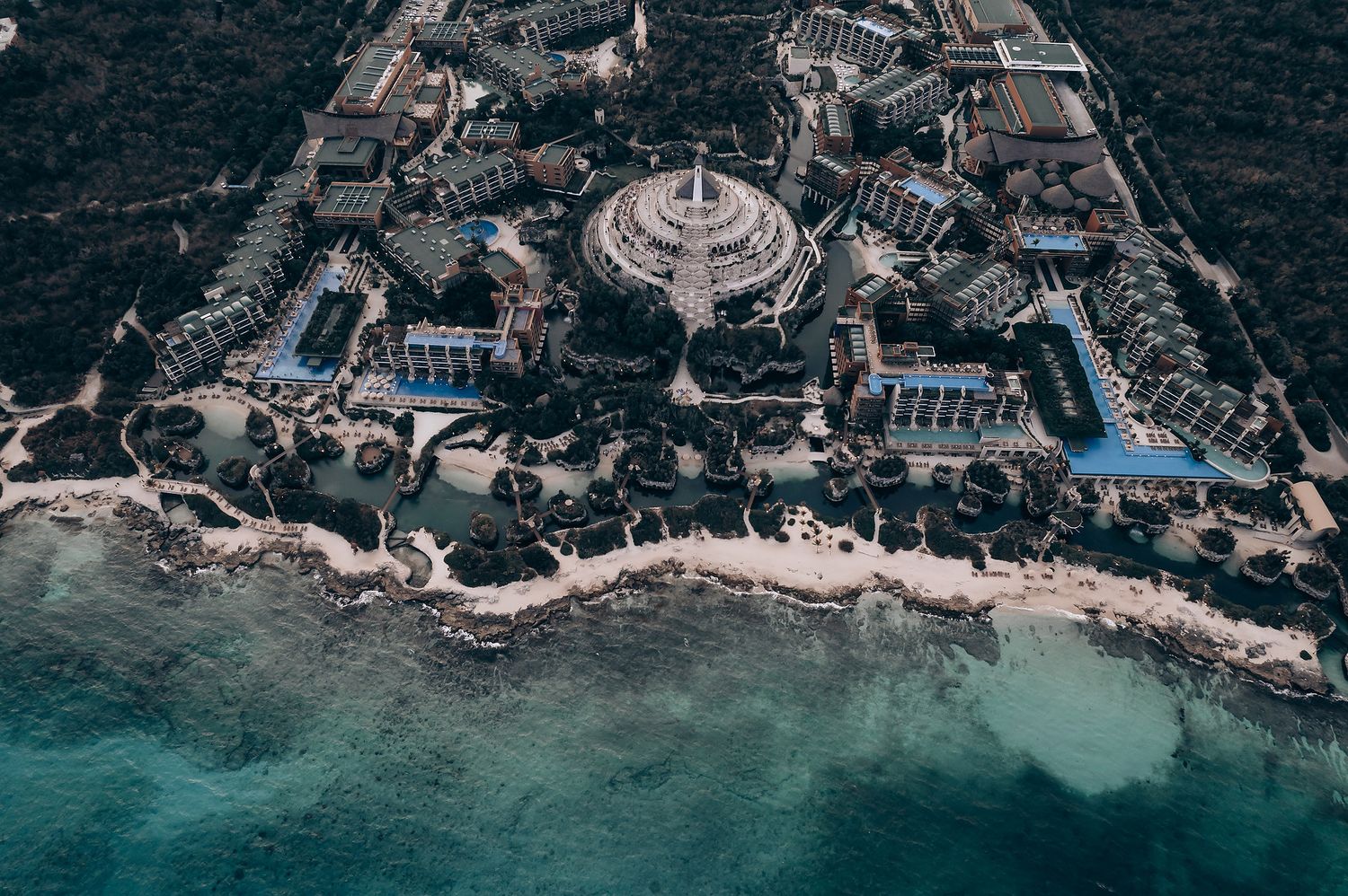 Aerial photograph of a coastal resort property with beaches and luxury amenities.