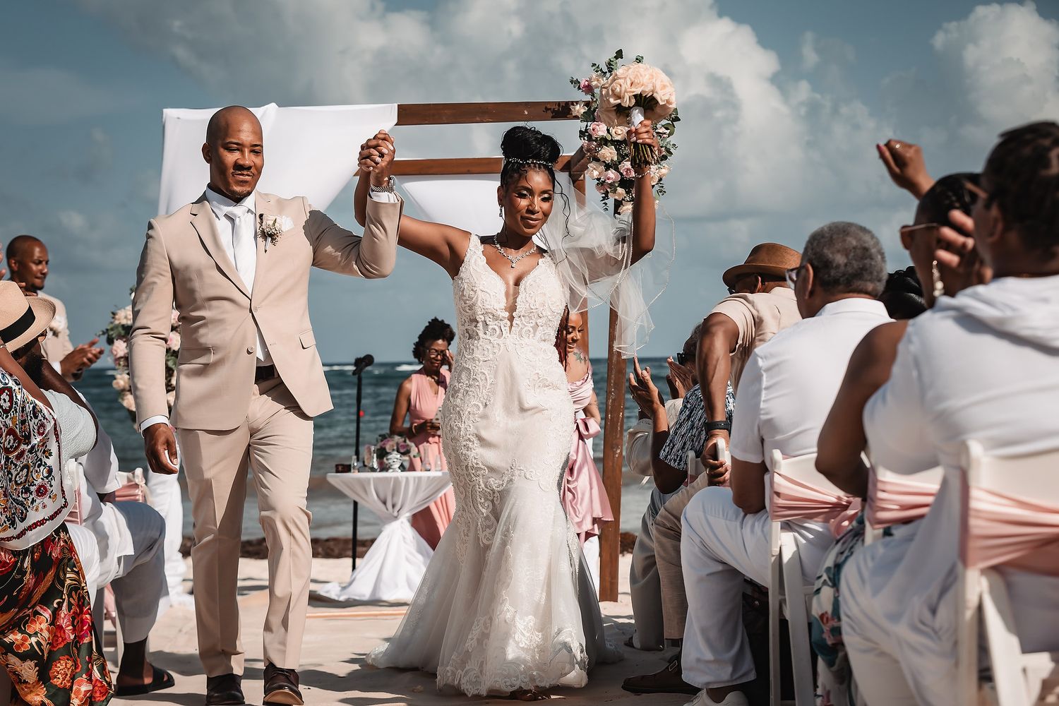 Wedding couple walking on the beach at Dreams Tulum Riviera Maya