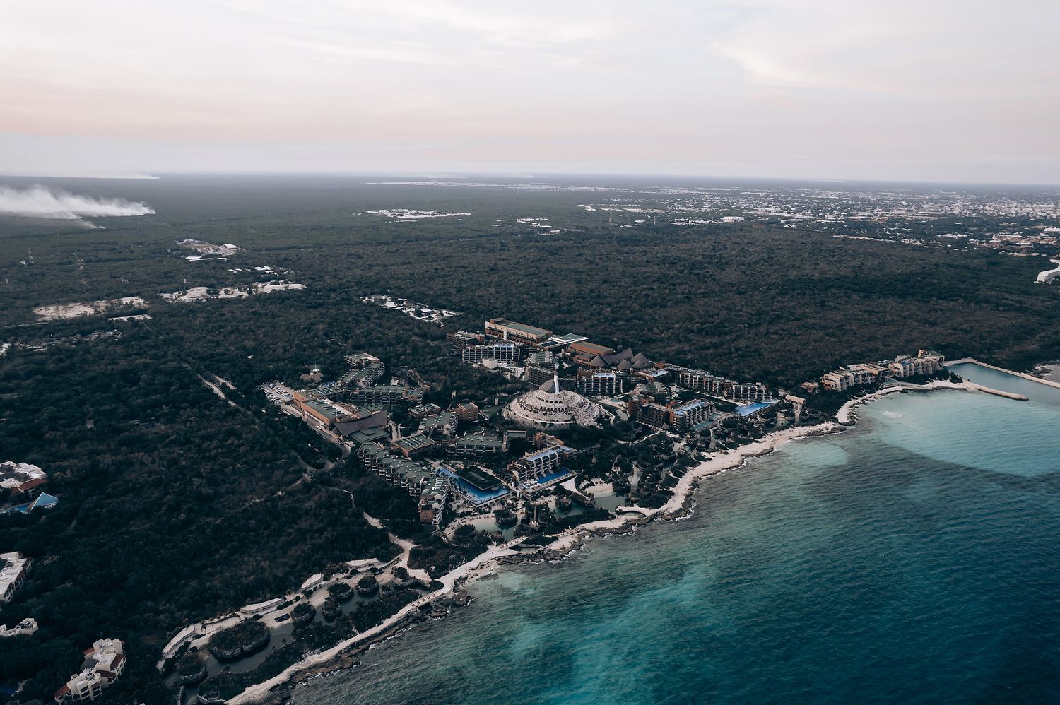 Aerial view of a coastal landscape with beaches and residential areas.