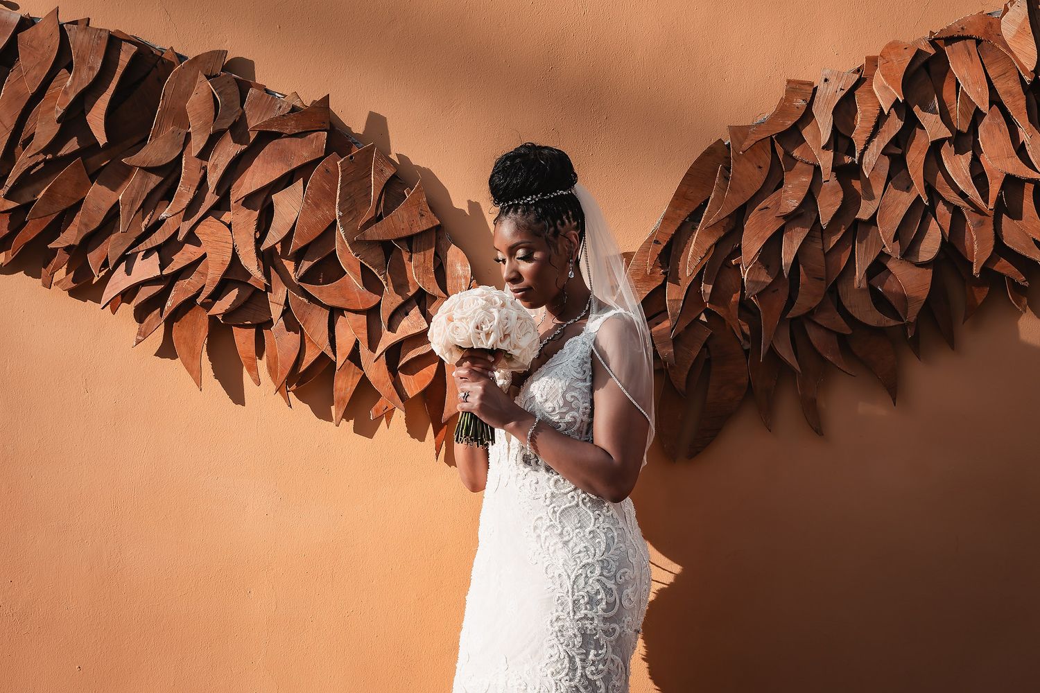 Decorative brown fabric drapes create an elegant backdrop for a wedding celebration.