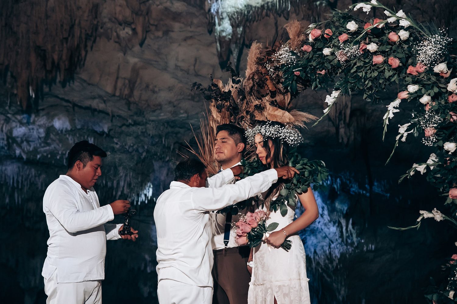 A series of candid dance moments captured at a celebration with people in white attire against a dark background.