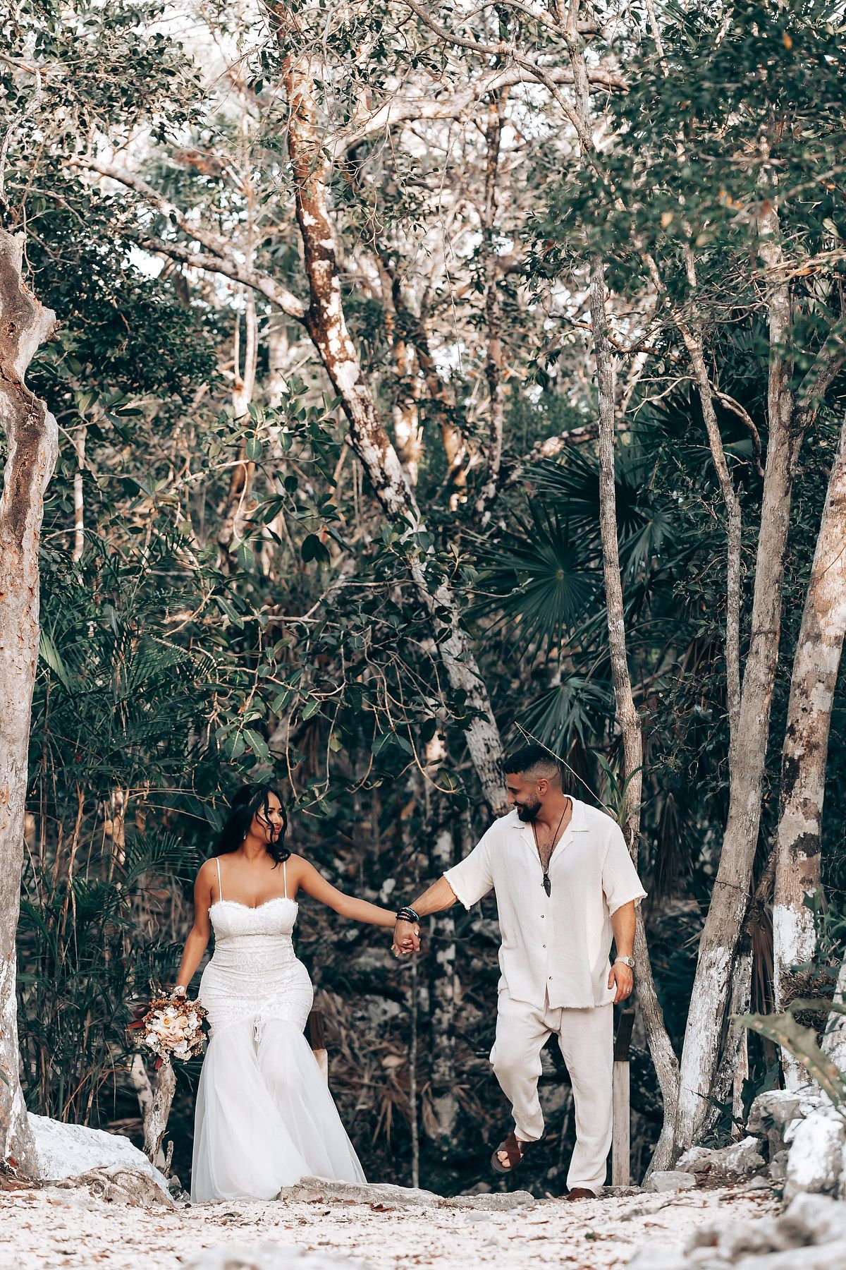 Elegant outdoor photo session in a white-barked forest with natural sunlight filtering through the trees.