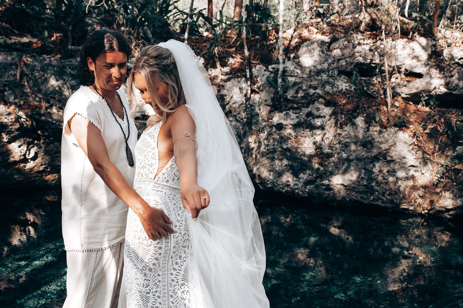 Romantic wedding couple shares intimate moments in a series of black and white photographs against a textured wall.