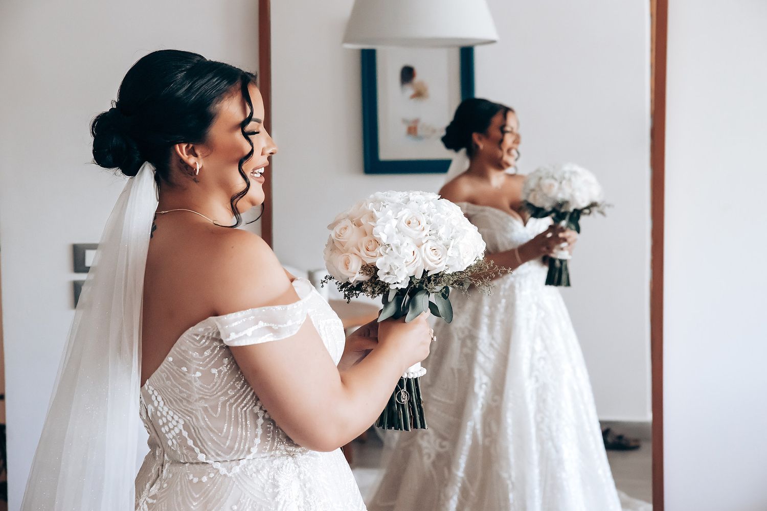 Wedding preparation scene with elegant white dress and bouquet in natural light.