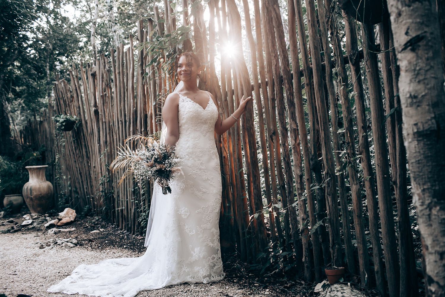 A wedding photo series captured in a sunlit forest with tall trees creating a natural backdrop.