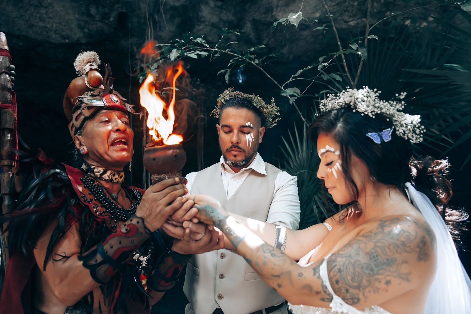 Wedding celebration with traditional ceremonial elements in a natural setting.