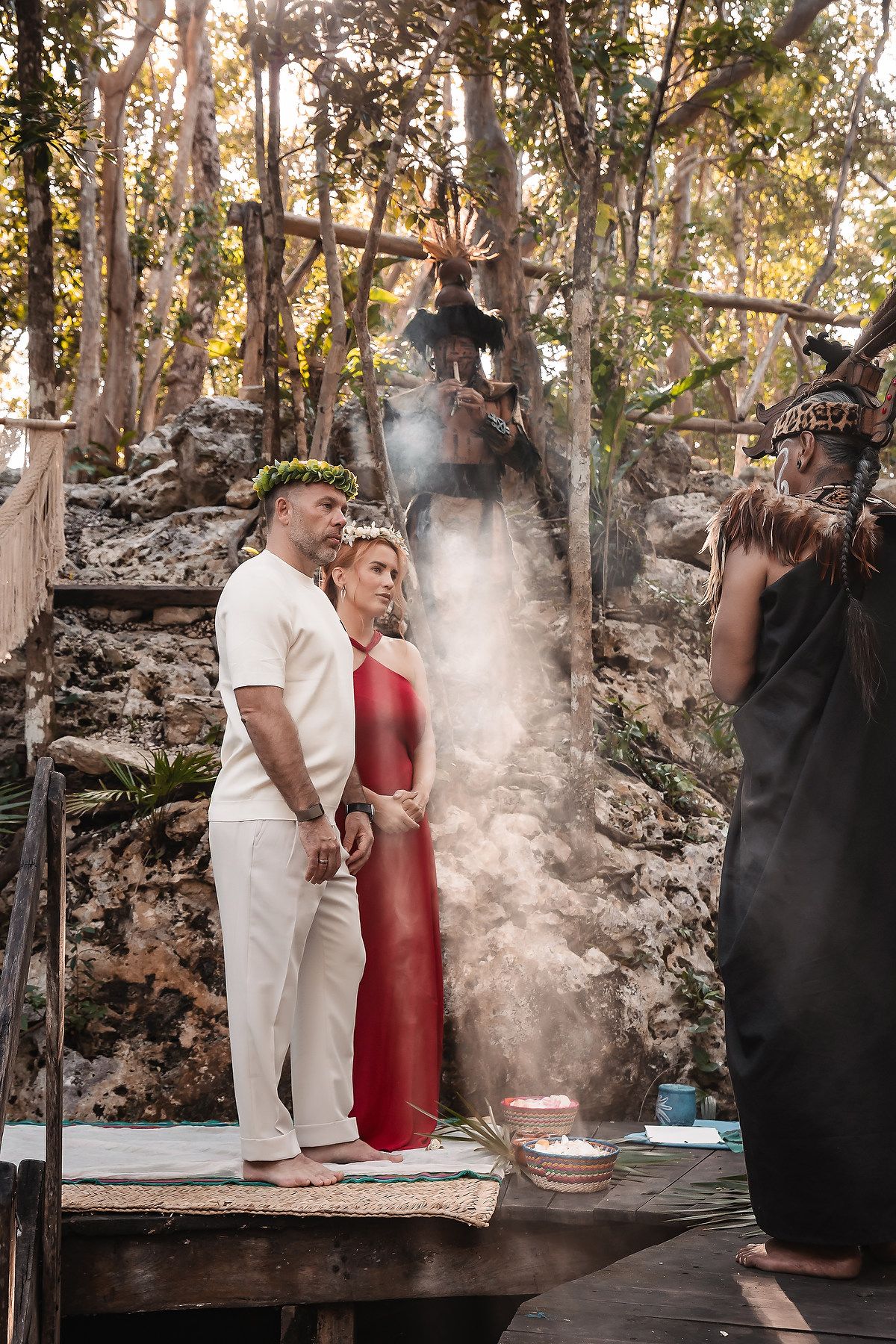 Mystical ceremony with smoke elements in a forest clearing surrounded by ancient stone walls.