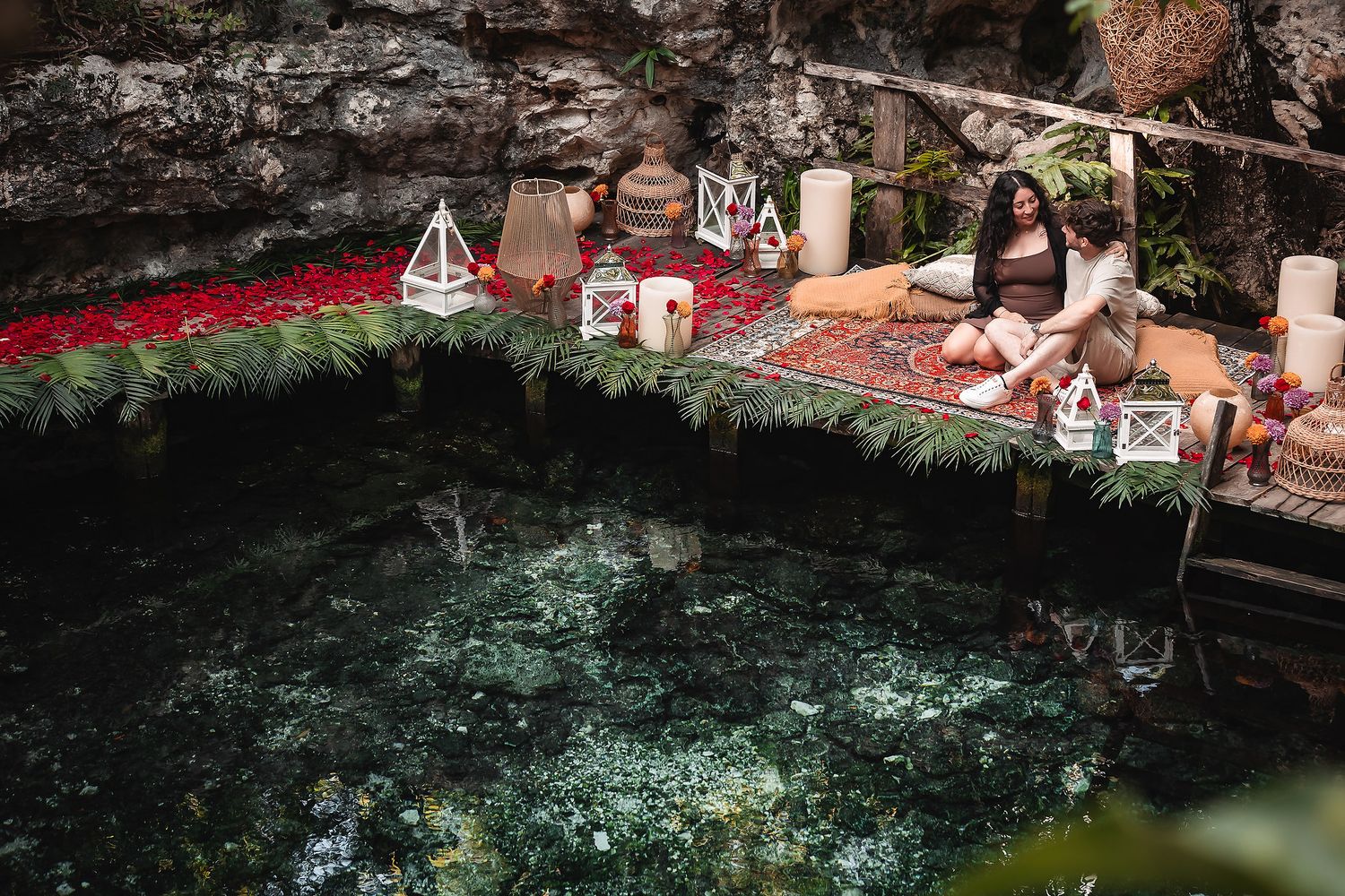 Scenic cenote view with decorative elements and turquoise waters reflecting natural light.