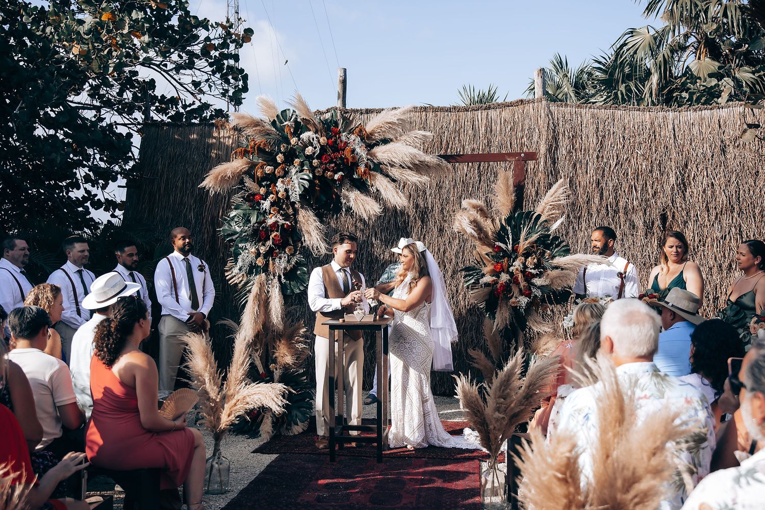 Outdoor wedding ceremony setup with rustic decor and natural surroundings.