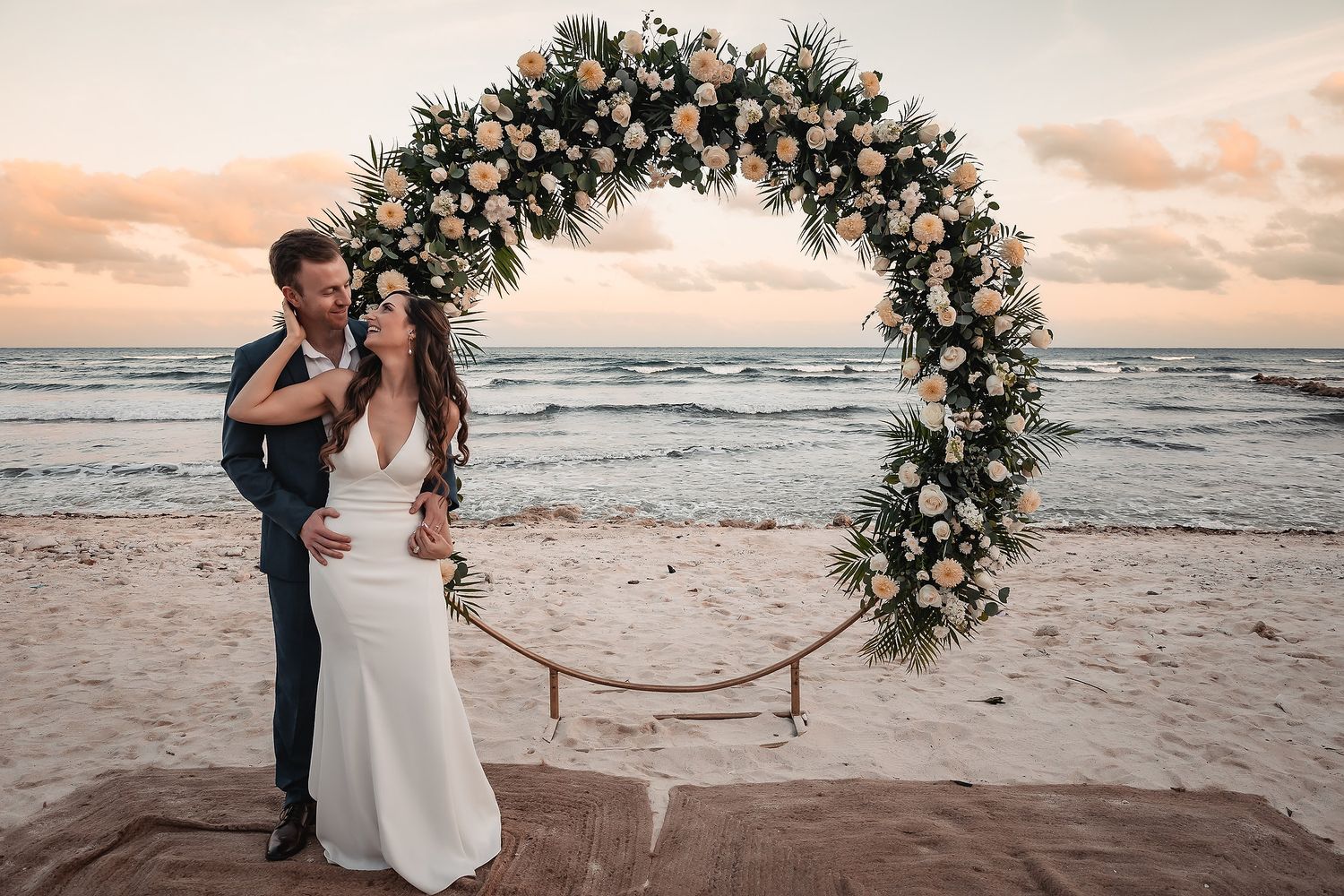 Bride and groom walking on the beach at Blue Venado Riviera Maya wedding