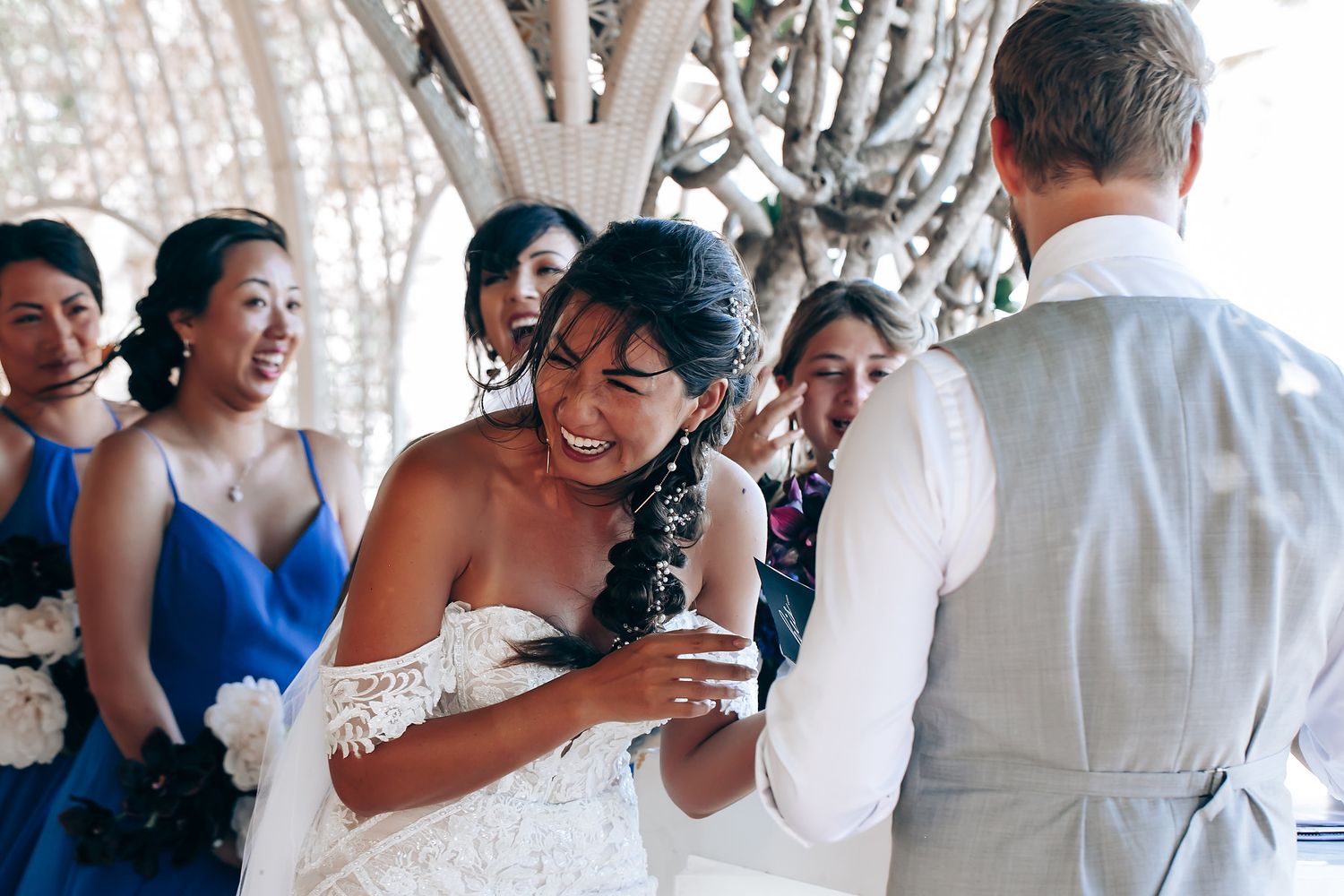 Wedding guests celebrate and dance together during an elegant indoor reception celebration.