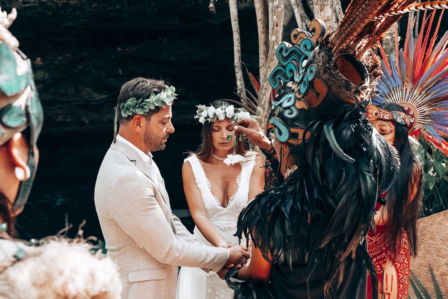 An intimate wedding celebration in a tropical garden setting with festive decorations.