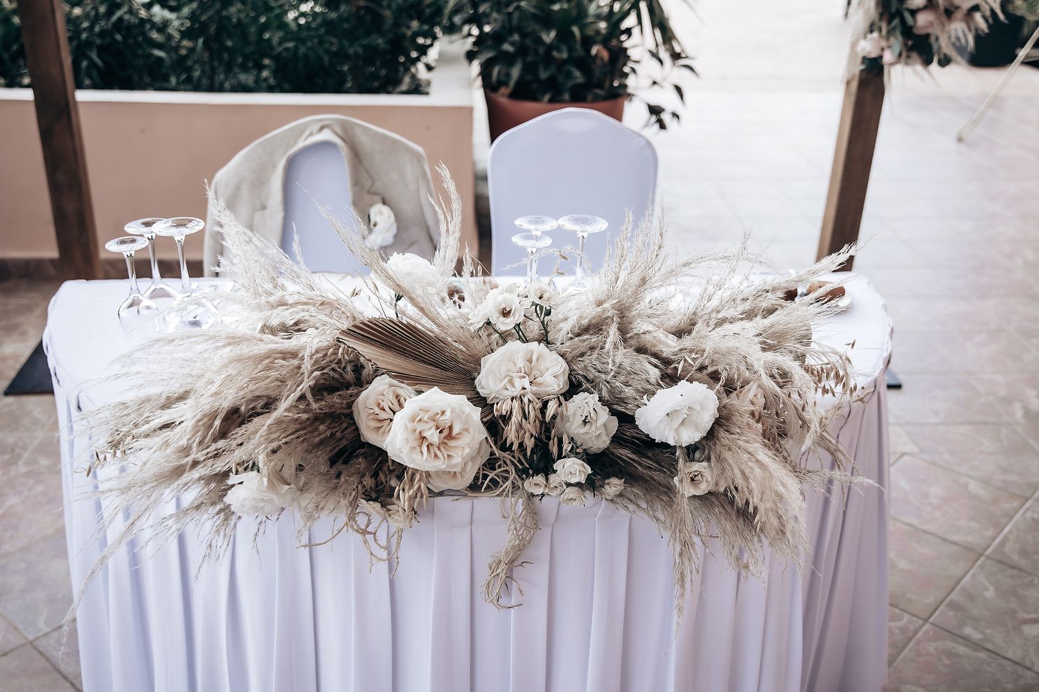 A table is decorated with flowers and other wedding decor.