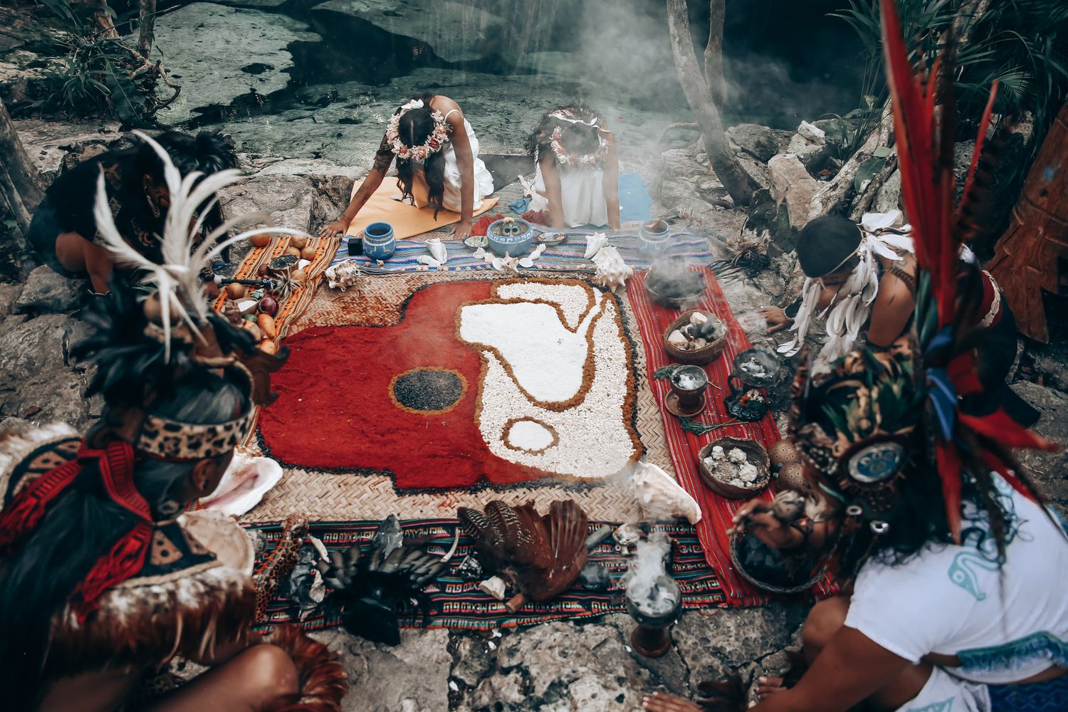 A dramatic ritual scene with smoke effects and red lighting creates a mystical atmosphere in nature.