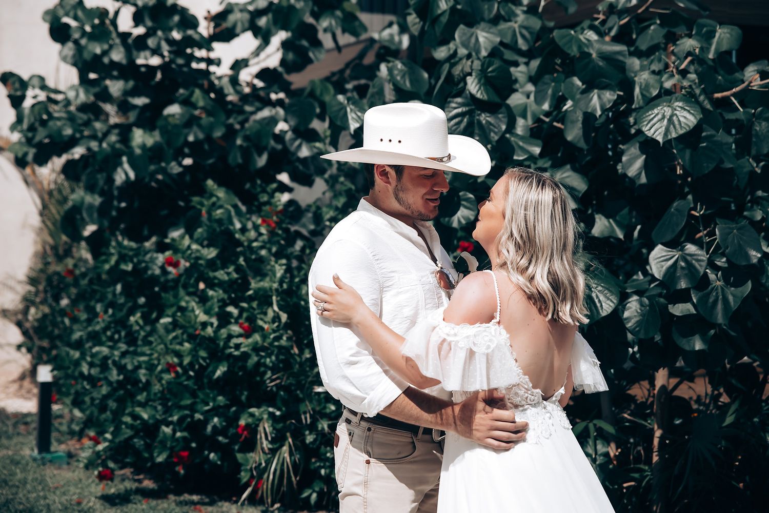 Romantic dance sequence captured in a lush garden setting with greenery.