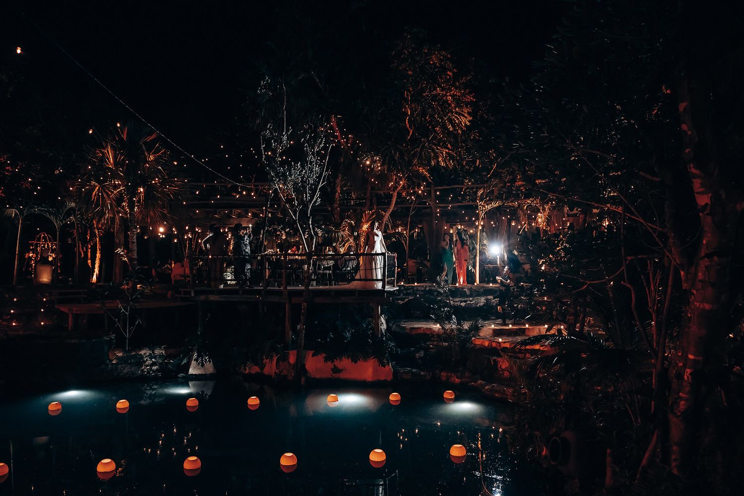 Nighttime outdoor scene with string lights creating a romantic ambiance.