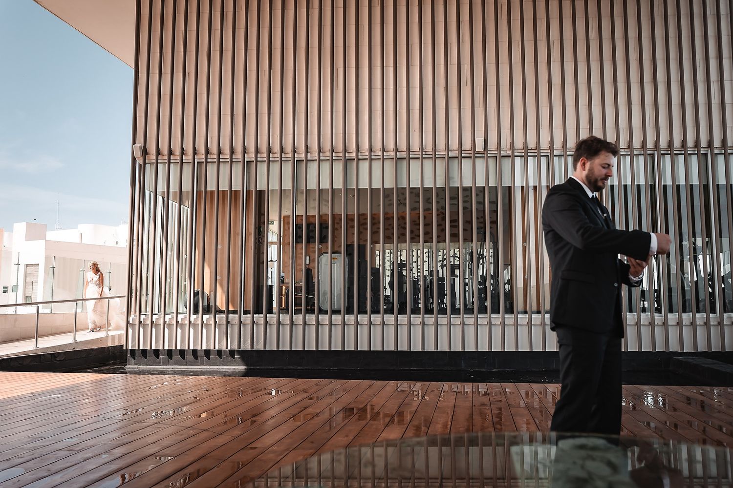 Minimalist architectural detail showing wooden slat wall panels in a modern space.