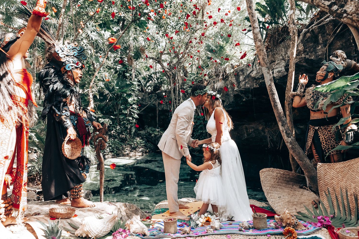 An outdoor wedding ceremony in progress with traditional elements and natural forest backdrop.