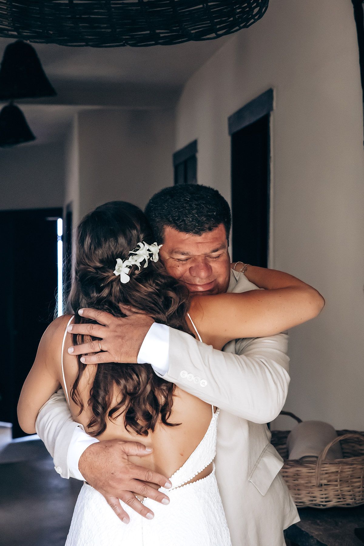 Emotional wedding day first look moment captured indoors.