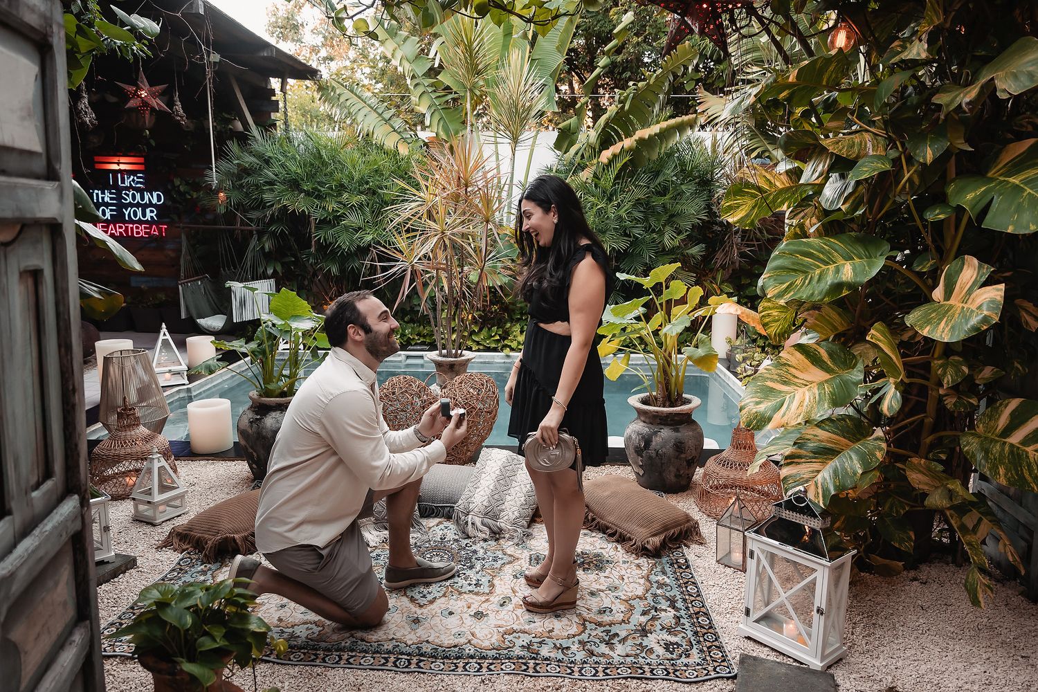 Behind-the-scenes view of a photo shoot in a tropical garden environment.