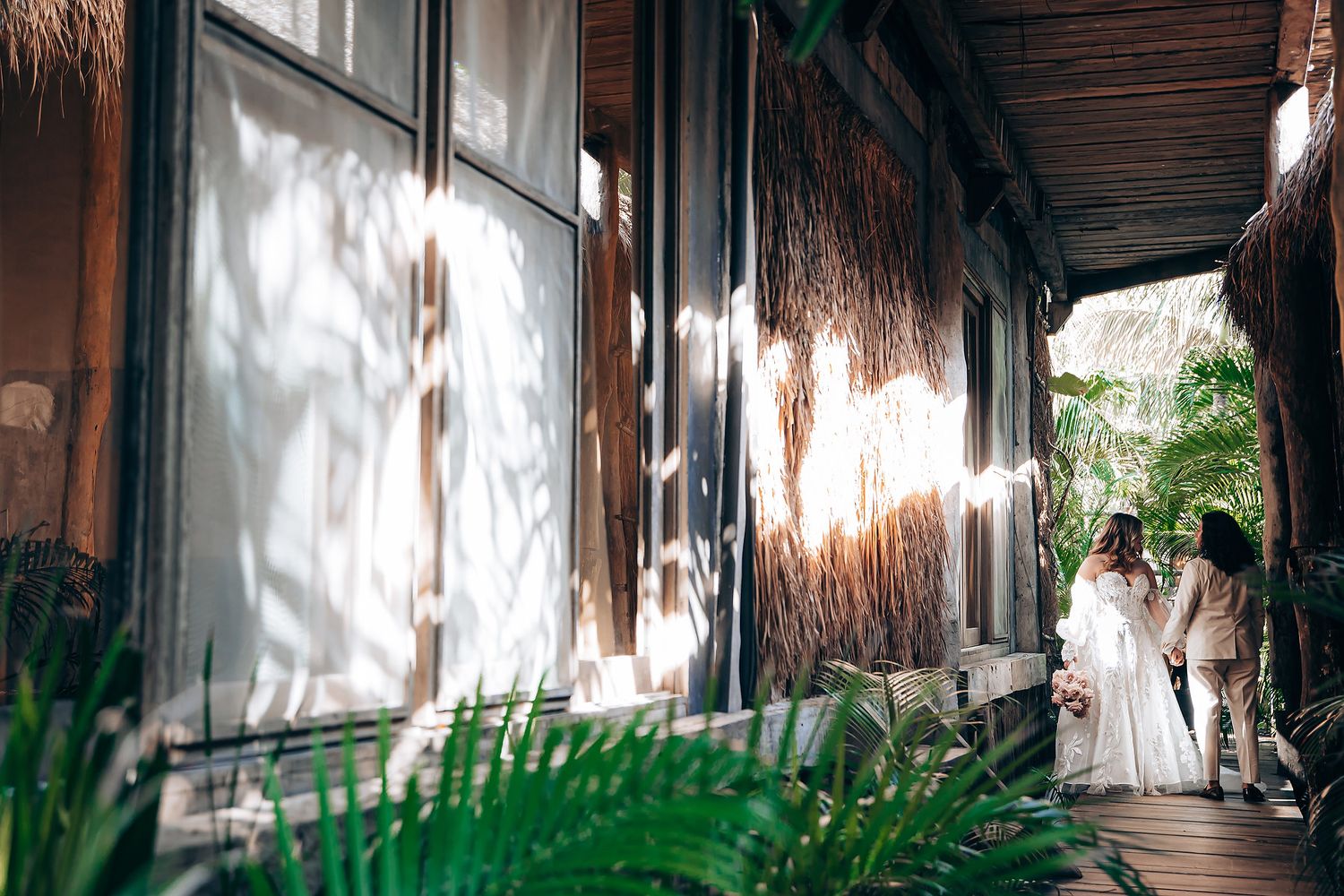 Sunlight streams through windows creating dramatic shadows in a rustic wedding venue.