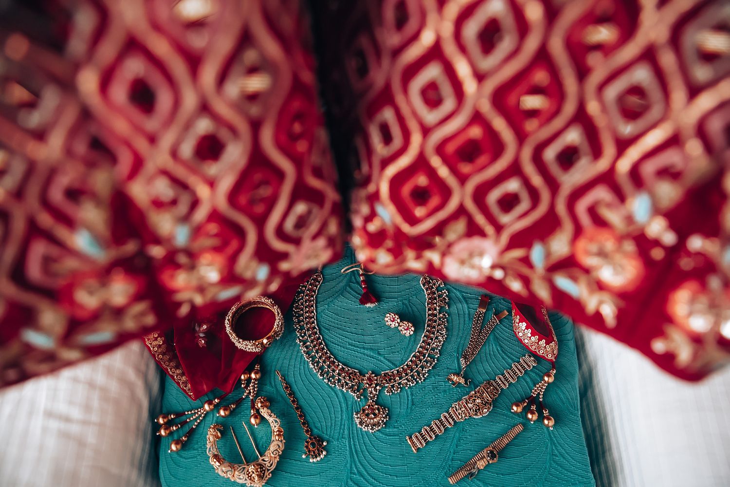 Traditional Indian wedding ceremony preparations with intricate jewelry and decorative elements.