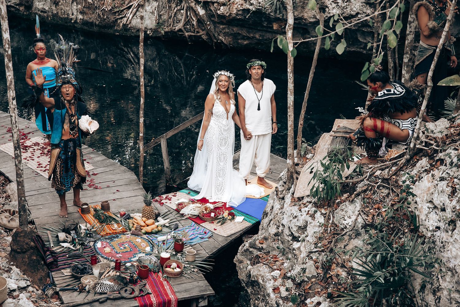 People enjoy swimming and relaxing at a natural cenote cave pool in Mexico's Yucatan Peninsula.