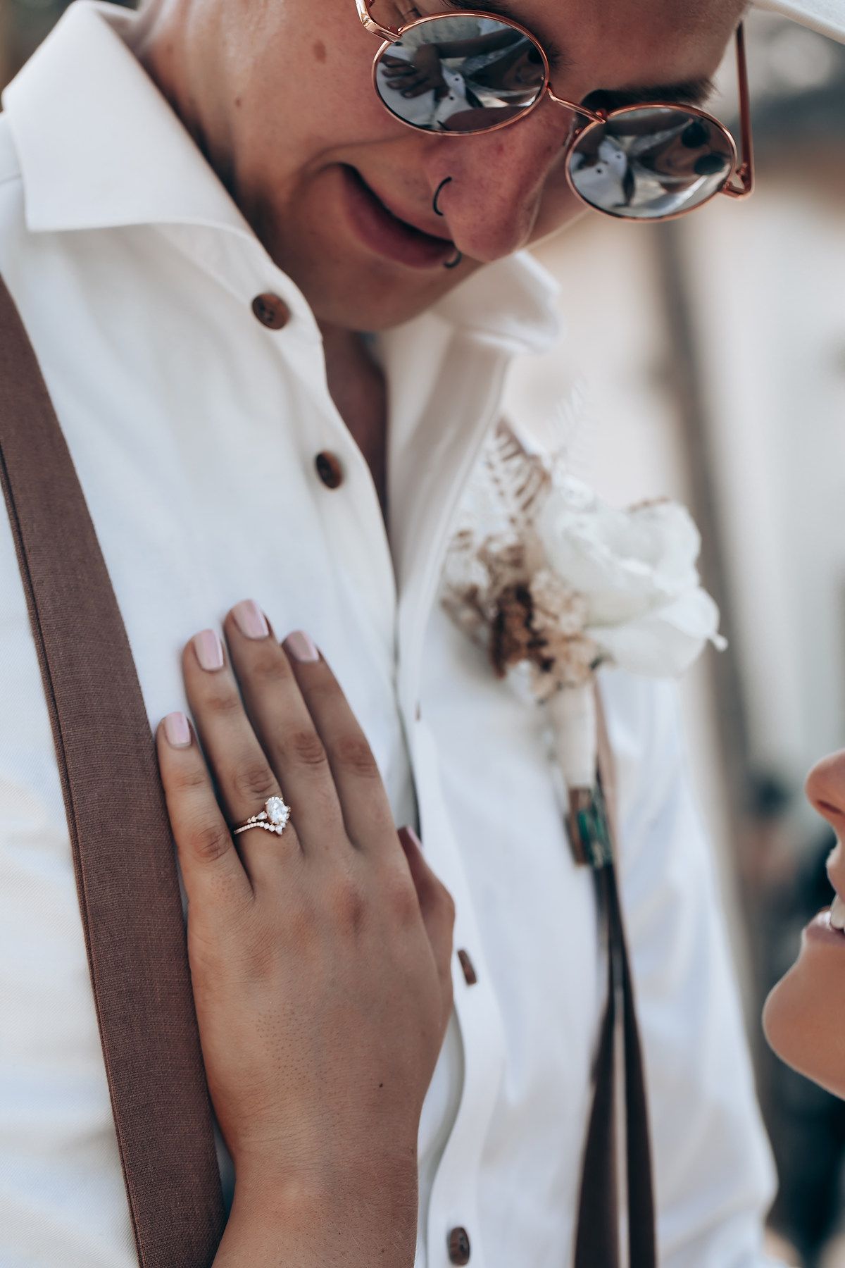 Close-up shots of engagement ring and emotional wedding day moments.