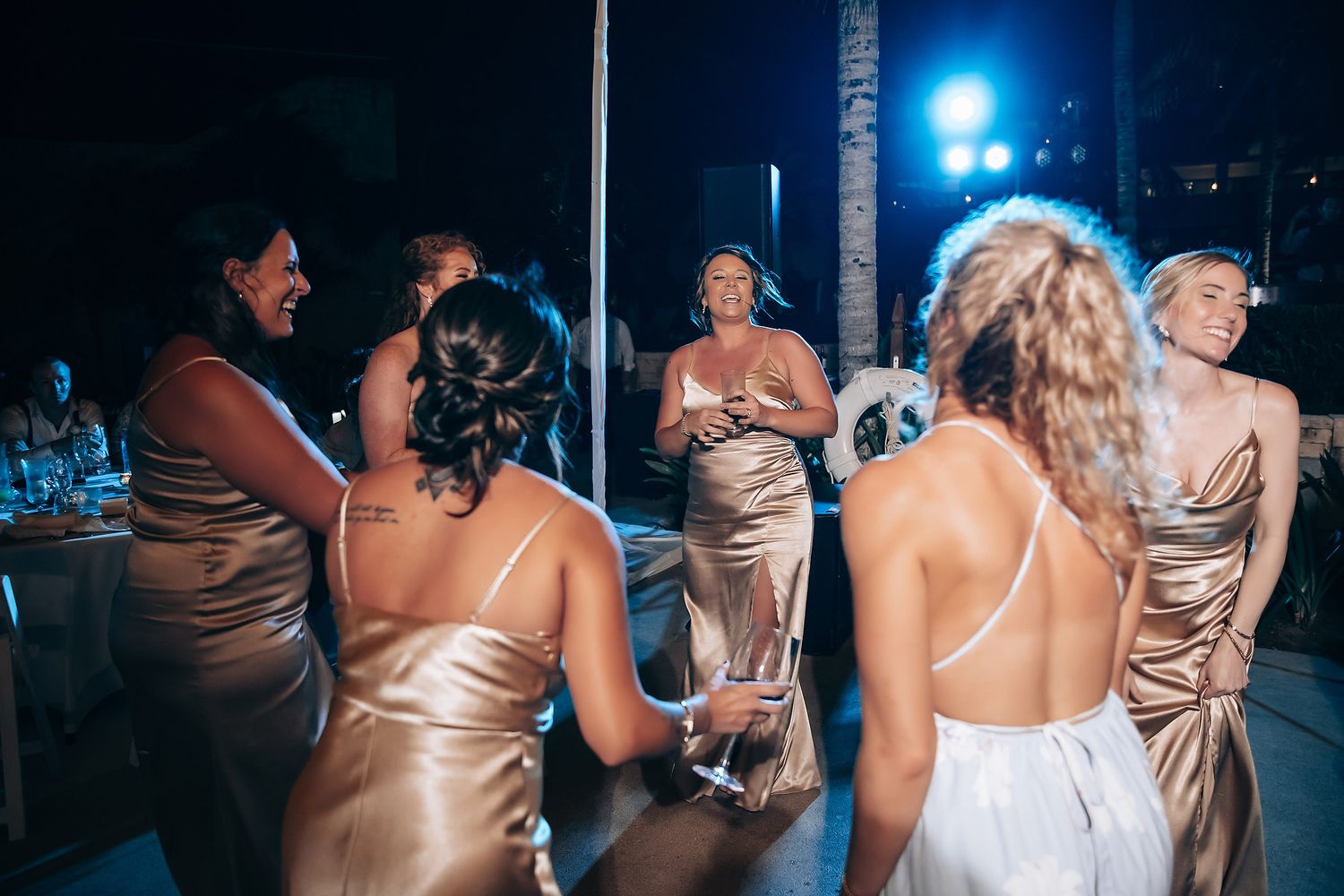 Wedding reception dance party with guests in formal attire enjoying the celebration.