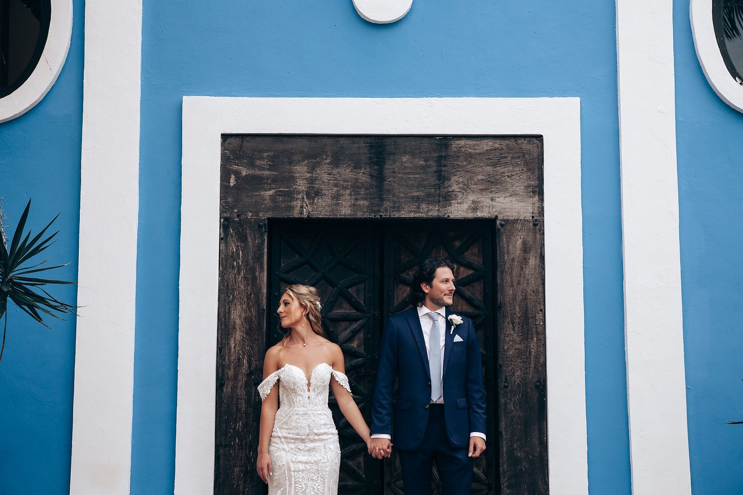 Modern wedding venue features striking blue and white architectural details.