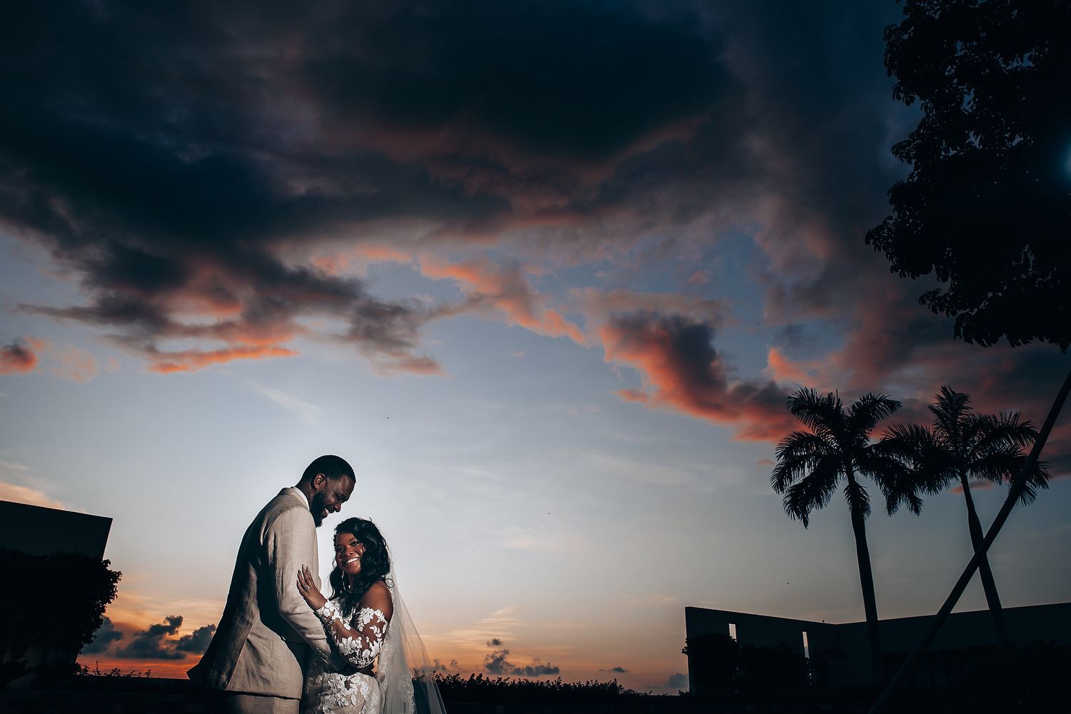 Wedding couple walking by the beach at Dreams Natura Riviera Maya