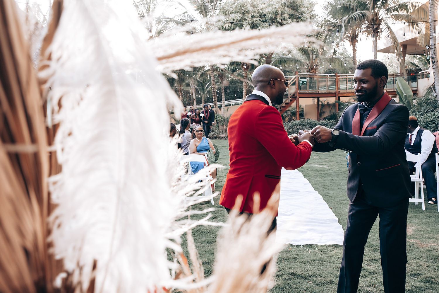A series of candid wedding moments captured in black and white showing dancing and celebration at an outdoor reception.