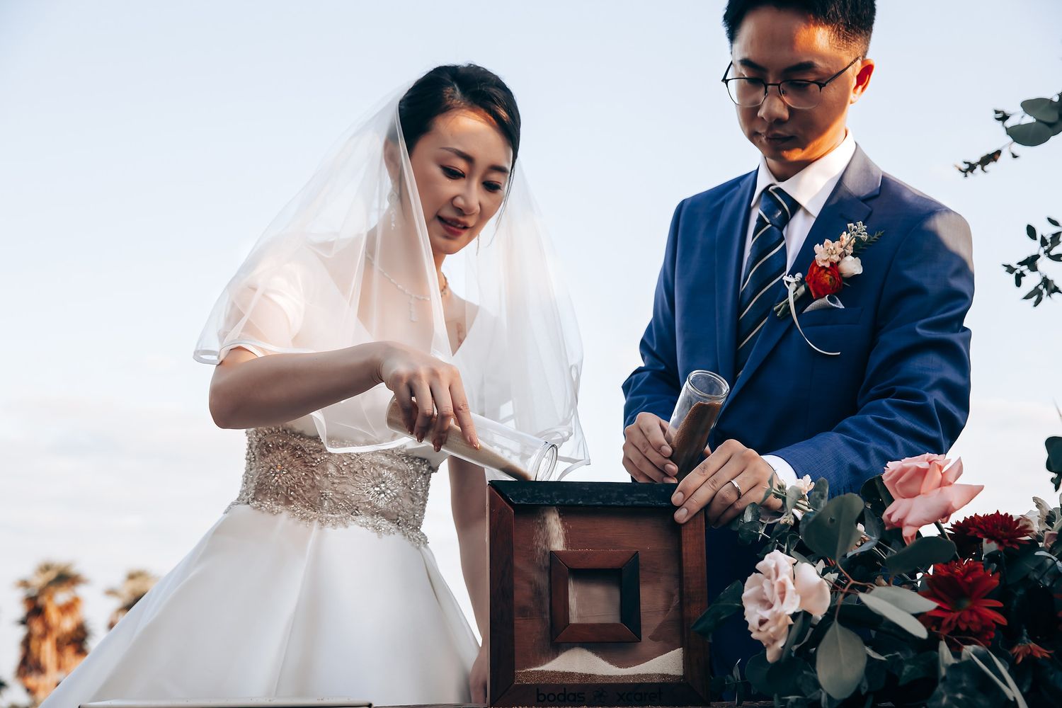 Elegant outdoor wedding ceremony with natural lighting and scenic backdrop.