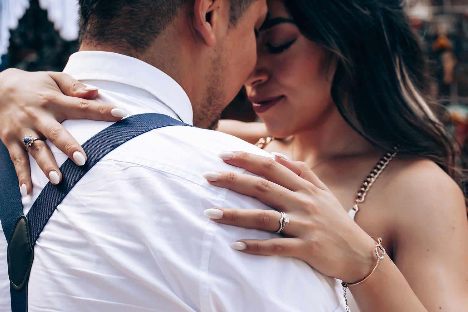 A romantic couple shares an intimate dance moment at a wedding celebration.