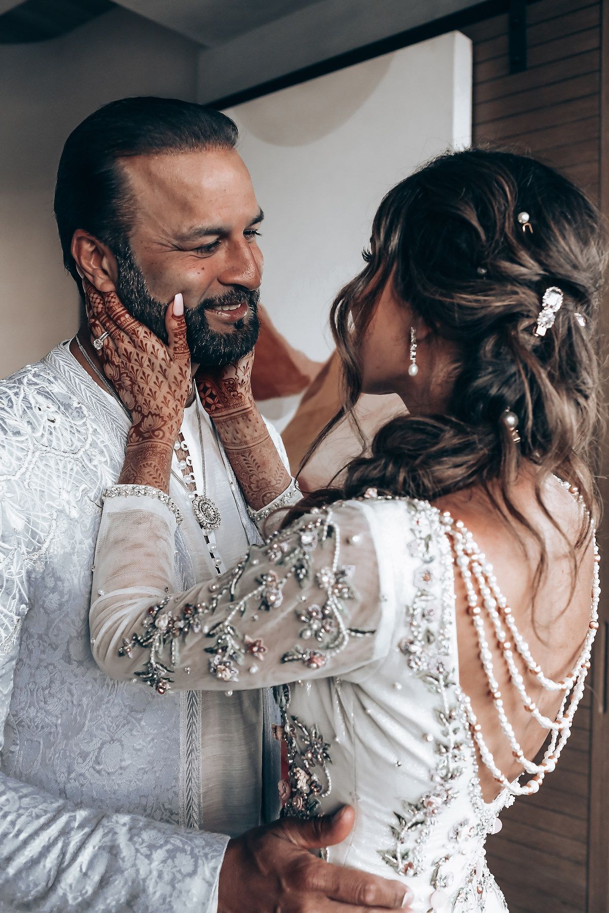 Series of intimate wedding photos showing tender moments in elegant white lace and pearl details.