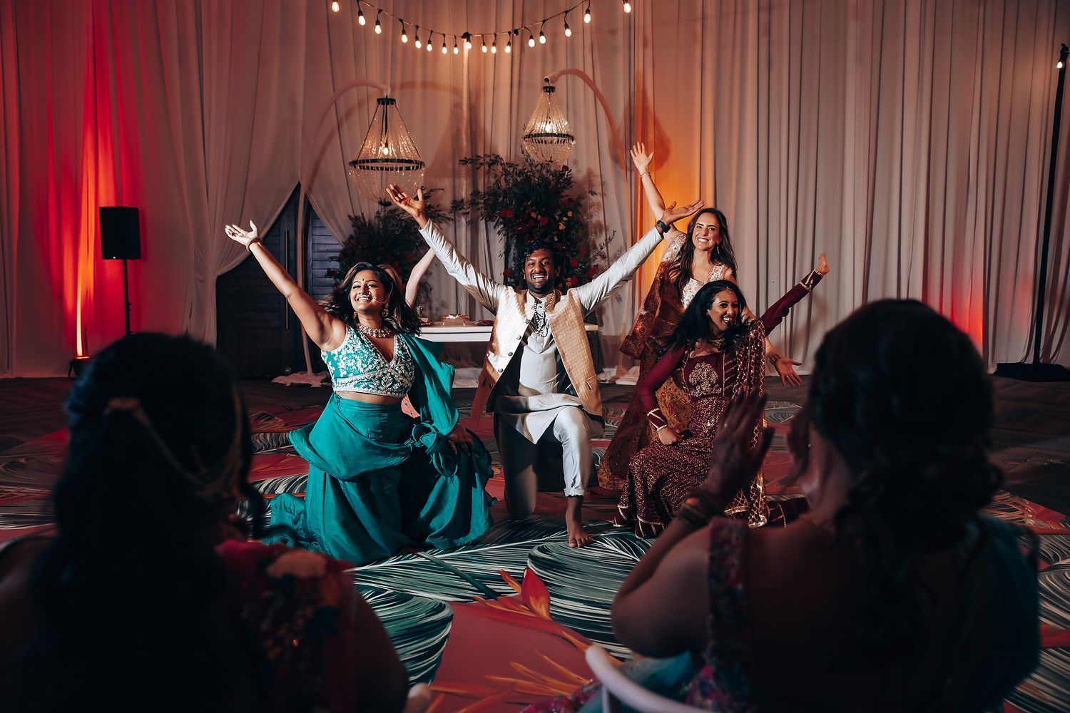 Dance party scene with string lights and colorful decorations.