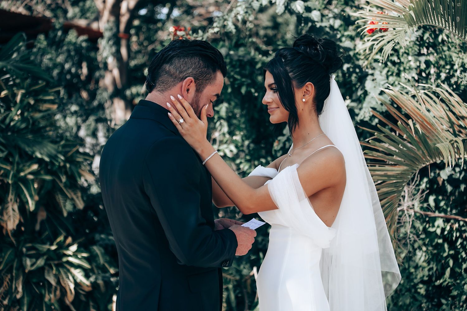 A tender moment shared between a couple during their wedding ceremony.