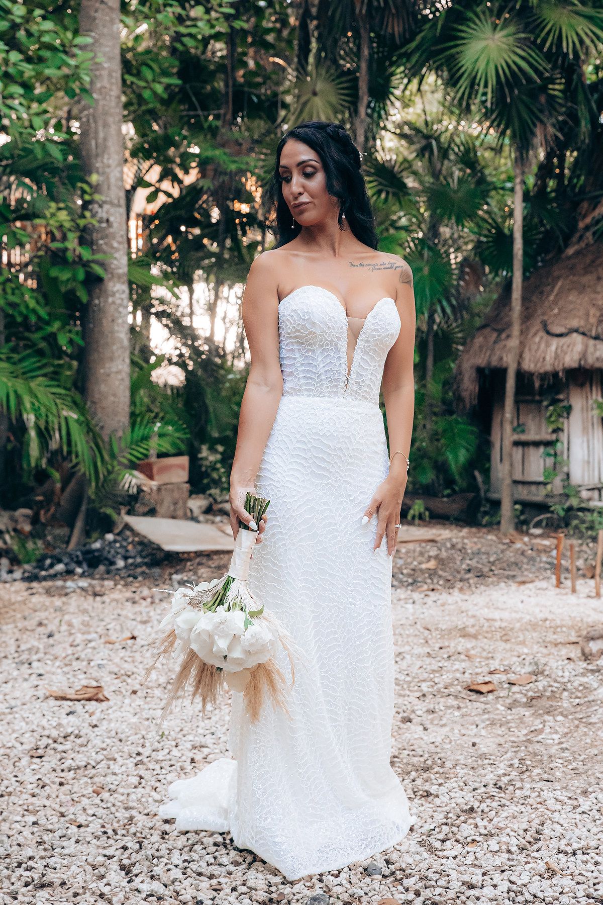 Beautiful white lace wedding dress photographed in segments against a tropical garden backdrop.