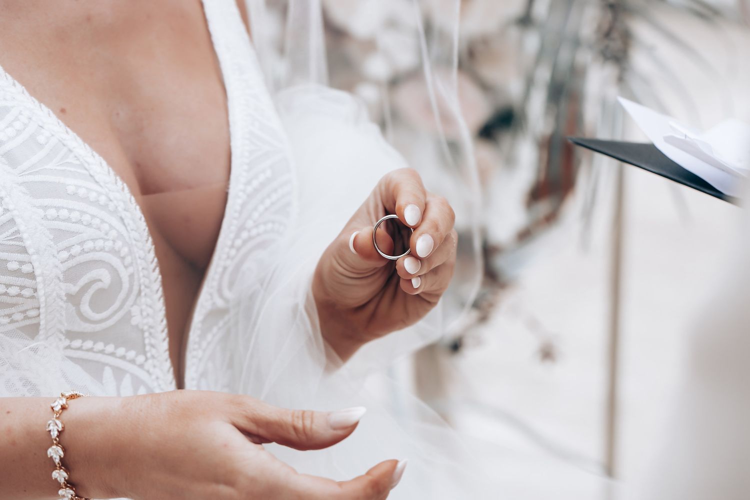 Close-up details of wedding ceremony preparations with white decor.