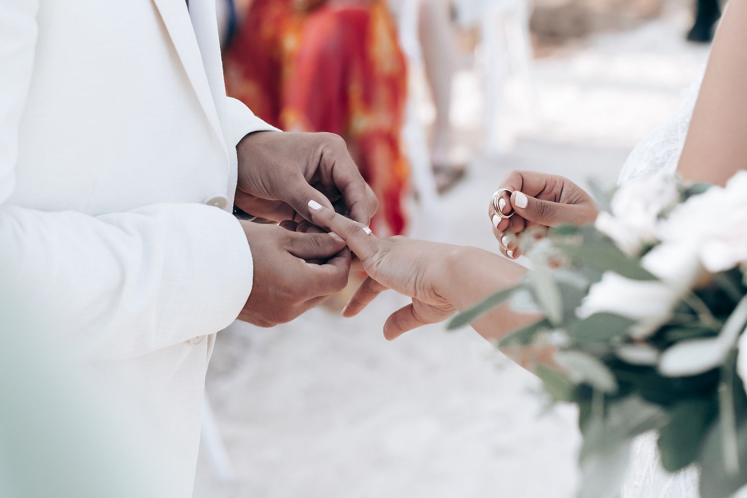 Close-up details of wedding ceremony preparations with floral arrangements and decor elements.