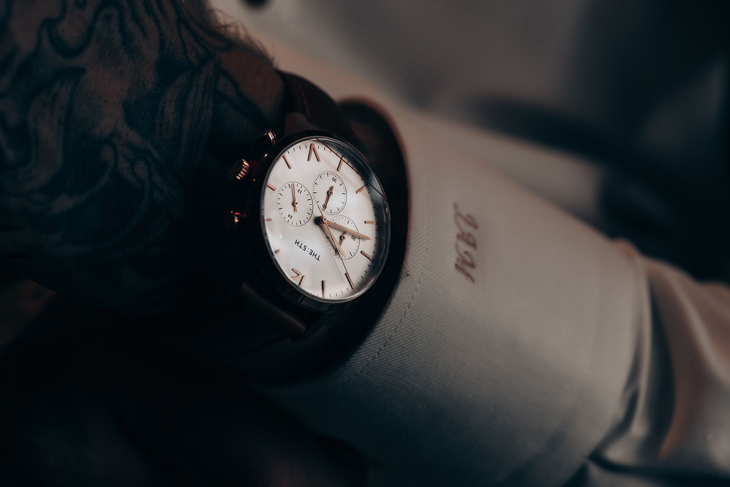 Elegant wristwatch detail shots in dramatic lighting.