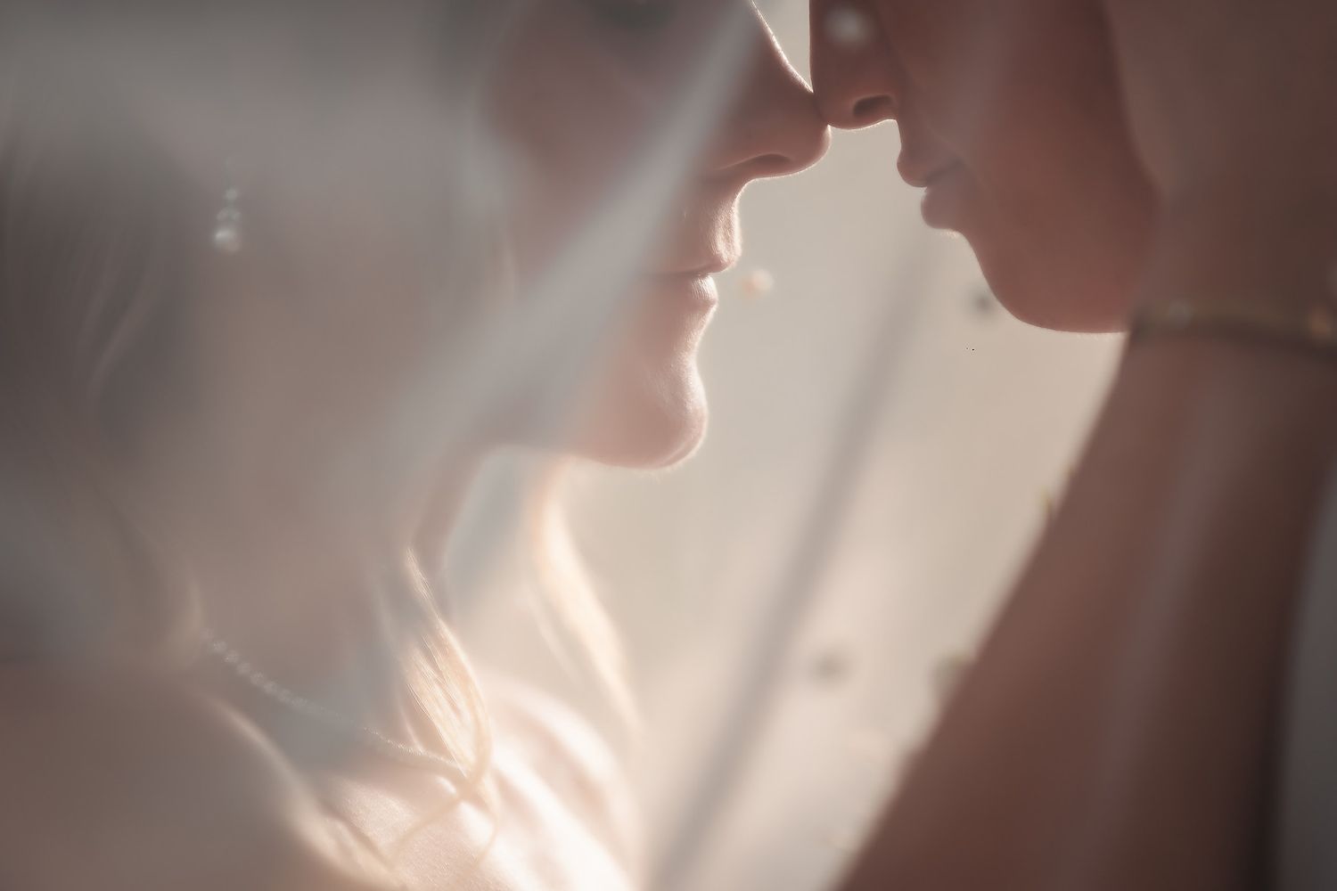 Soft focus close-up shots capture tender wedding moments in natural lighting.