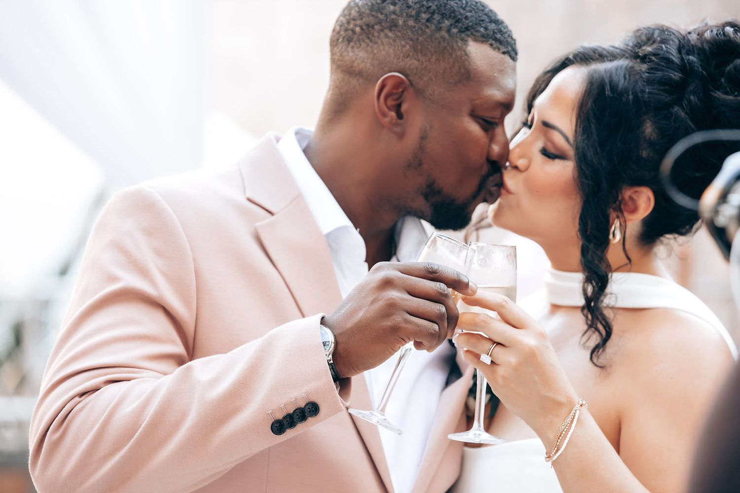 Romantic close-up shots of a couple sharing intimate moments at their wedding.