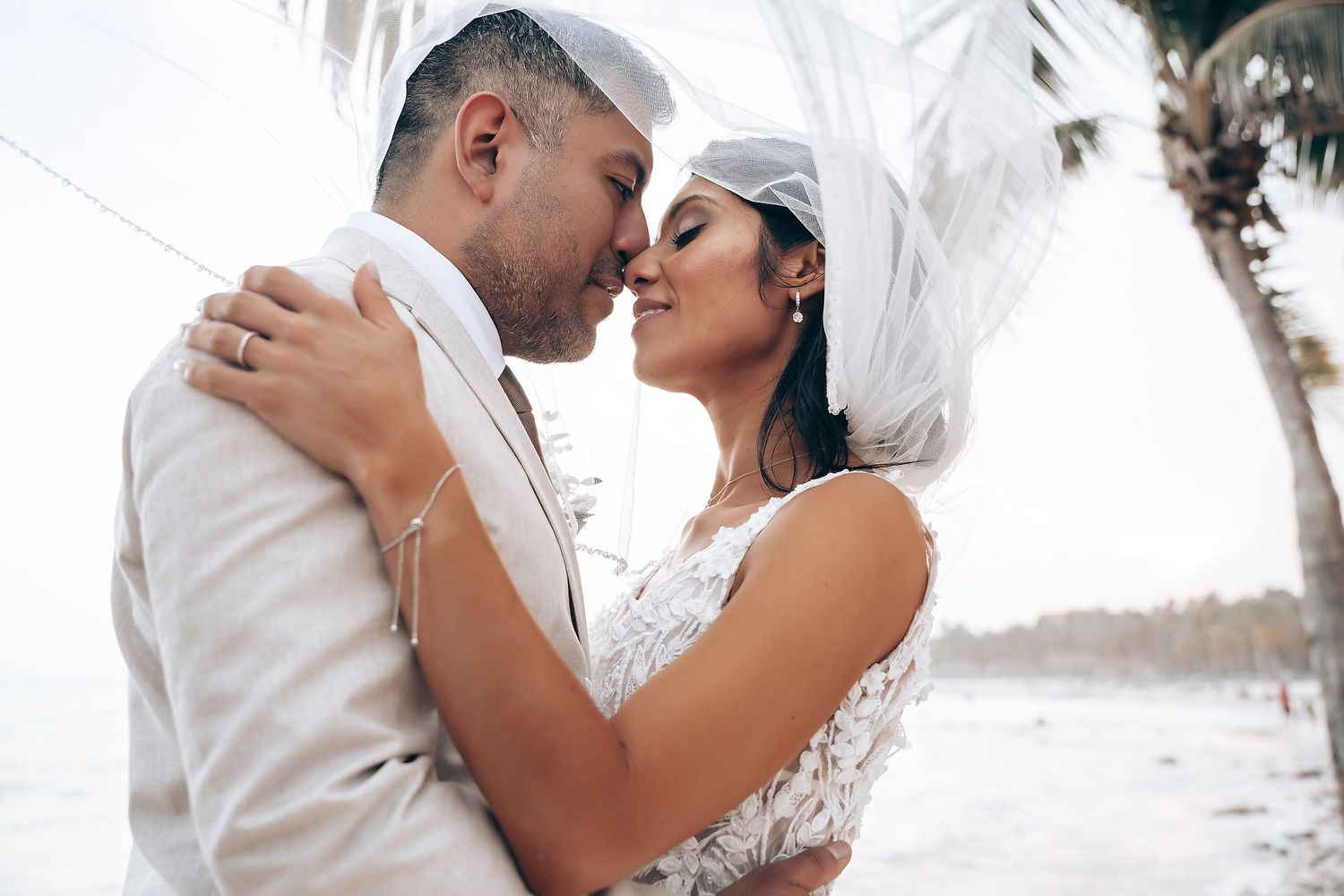 Bride and groom kiss during Barcelo Riviera Maya ceremony