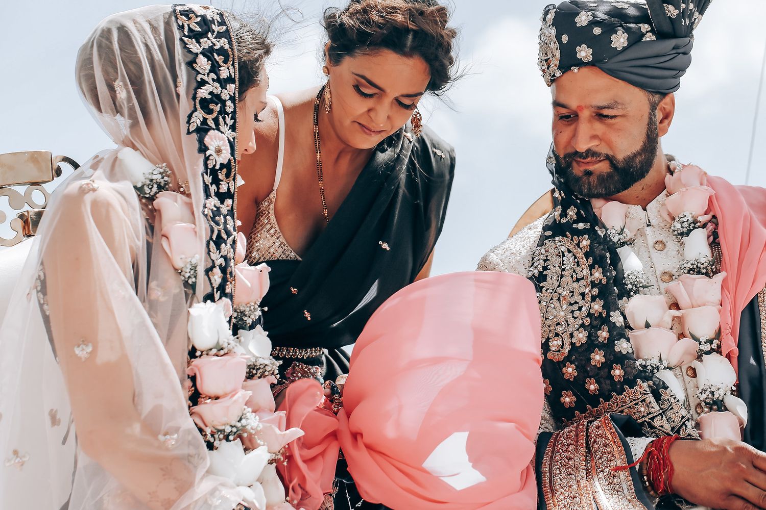 Wedding couple embracing in a series of candid moments wearing floral and polka dot accessories.