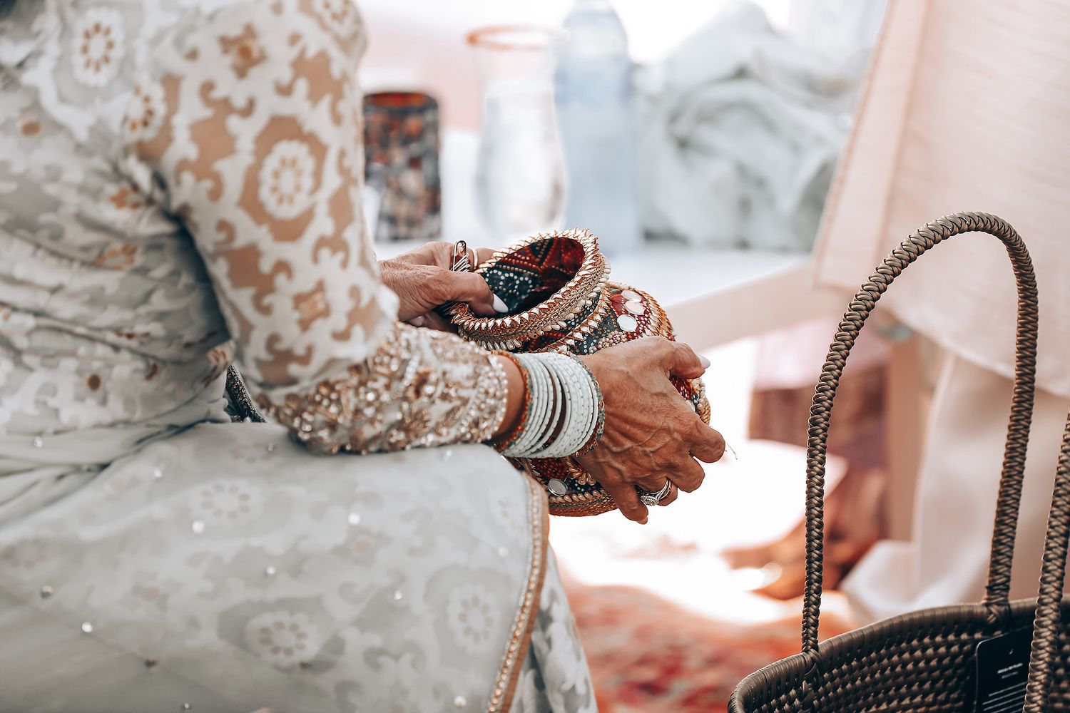 Intricate details of wedding preparations with jewelry and accessories in soft, romantic lighting.